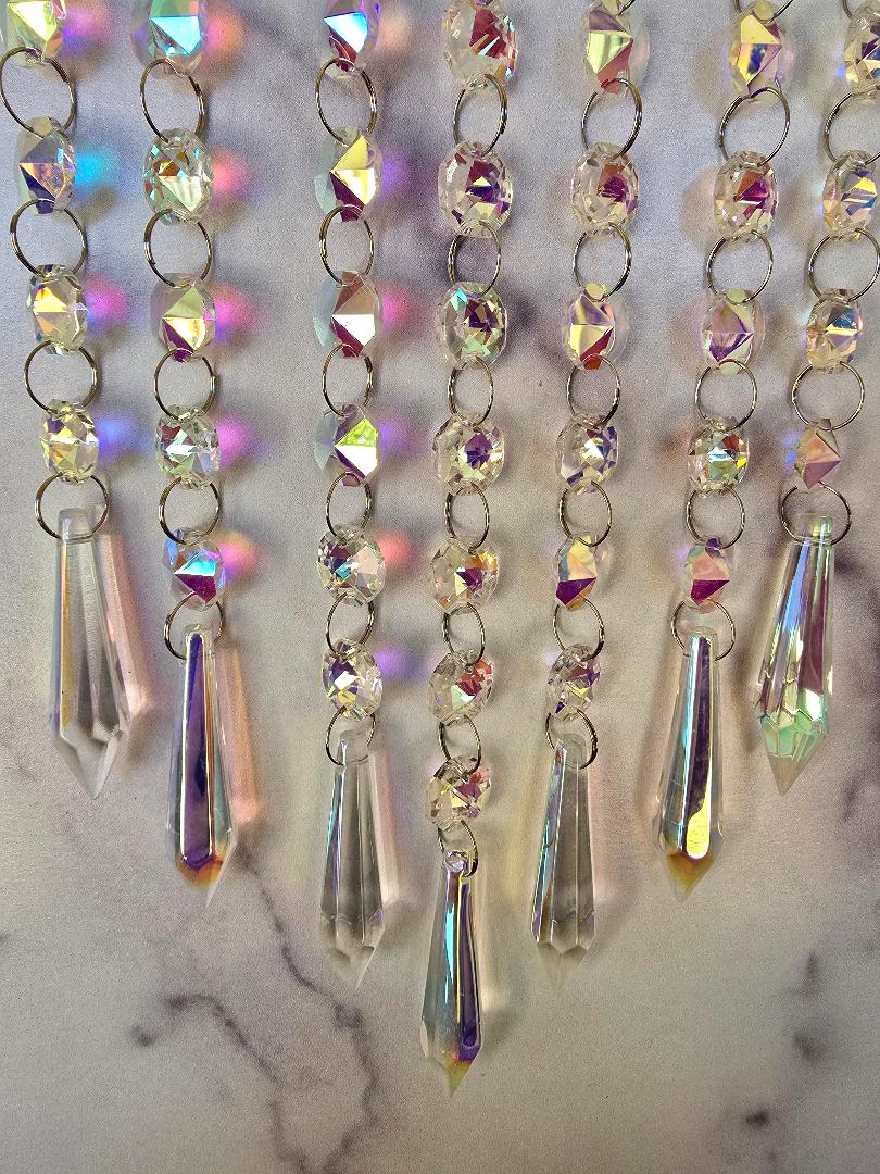 Close-up of the Aurora Crystal Suncatcher showing AB crystal beads and faceted prism pendants with vibrant rainbow reflections